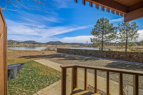 Lakefront Pagosa Springs condo with mountain views, a private deck, grill, and remodeled interiors; three bedrooms and 2.5 baths sleep up to 5 guests.