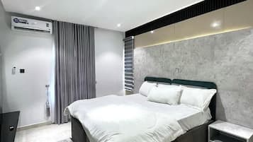 Economy Room, Balcony, City View | Desk, laptop workspace, blackout drapes, soundproofing