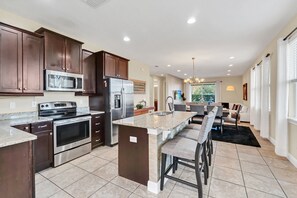 Fridge, microwave, oven, stovetop - Bright 8BR home w/ pool & hot tub (Kissimmee)