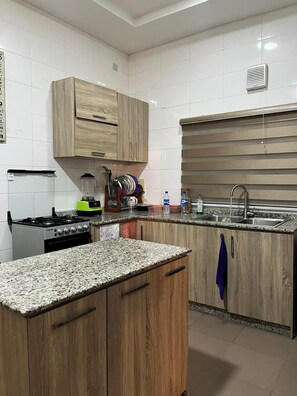 Economy Apartment, Balcony, City View | Private kitchen | Fridge, microwave, oven, stovetop - Bigjay Apartment (Abuja)