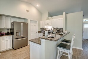 Fridge, microwave, oven, stovetop - Sunrise Coastal Cottage New Vacation Home, Heated Pool, Waterfront, Kayaks, . (Cape Coral)