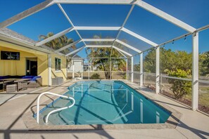 Outdoor pool, a heated pool - Sunrise Coastal Cottage New Vacation Home, Heated Pool, Waterfront, Kayaks, . (Cape Coral)