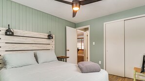 A bedroom with a bed, bedside lamps, a ceiling fan, and a wardrobe. - Rice Lake Escape w/ Private Dock: 1 Mi to Main St (Rice Lake)