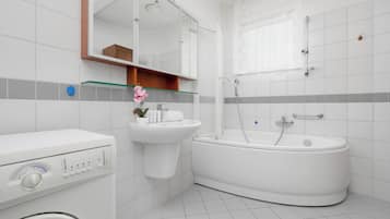 Shower, hair dryer, towels, shampoo