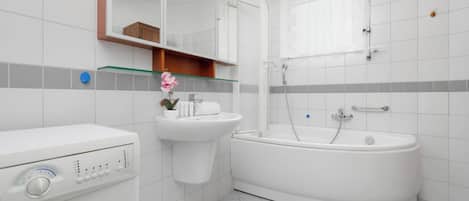 Shower, hair dryer, towels, shampoo
