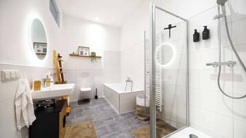 Shower, hair dryer, towels, shampoo