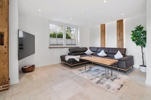 Living area - Vacation apartment Rettbrook - Stylish country vacation with garden idyll & fireplace (Bad Zwischenahn)