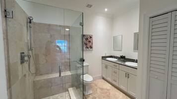 Shower, hair dryer, towels, soap