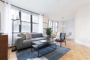 Living area - Walking distance to Beacon Hill, Back Bay + all tourist spots.  Great for work trip too, MBTA nearby (Boston)