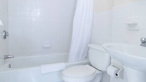 A bathroom with a bathtub, toilet, and sink. - Walking distance to Beacon Hill, Back Bay + all tourist spots.  Great for work trip too, MBTA nearby (Boston)
