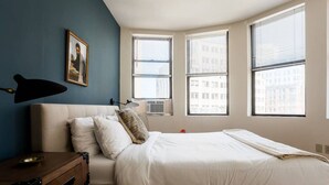 A bedroom with a bed, a dresser, a lamp, and a picture on the wall. - Walking distance to Beacon Hill, Back Bay + all tourist spots.  Great for work trip too, MBTA nearby (Boston)