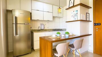 Exclusive Apartment, 1 Queen Bed | Private kitchen | Fridge, microwave, cookware/dishes/utensils, cleaning supplies