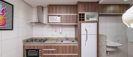 Traditional Apartment | Private kitchen | Fridge, microwave, cookware/dishes/utensils, cleaning supplies