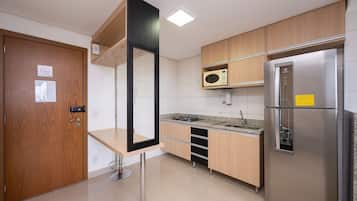 Basic Apartment | Private kitchen | Fridge, microwave, cookware/dishes/utensils, cleaning supplies