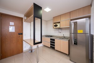 Basic Apartment | Private kitchen | Fridge, microwave, cookware/dishes/utensils, cleaning supplies