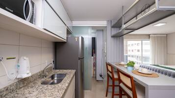 Exclusive Apartment | Private kitchen | Fridge, microwave, cookware/dishes/utensils, cleaning supplies