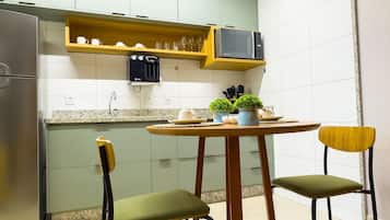 Comfort Studio | Private kitchen | Fridge, microwave, cookware/dishes/utensils, cleaning supplies