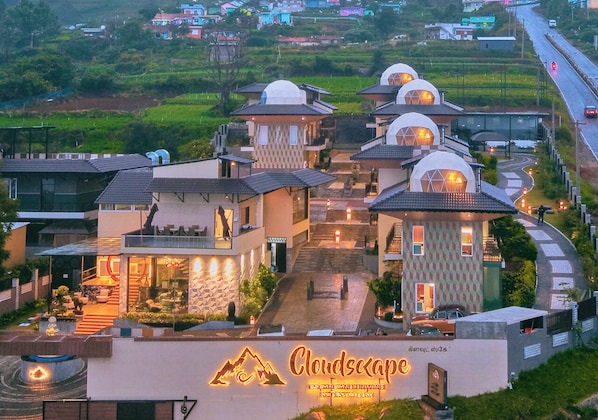 A hotel with multiple dome-shaped buildings, a central staircase, and a sign reading "Cloudscape".