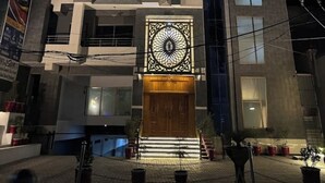 A multi-story building with a prominent sign for 'Sapphire Stay's Hotel & Restaurant'. - Sapphire Stays Peshawar  (Peshawar)