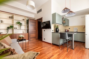 A modern apartment with a living area, a kitchen, and a dining space. - Garibaldi - Bright Cozy 1 BR in the Heart of Brera (Milan)
