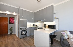 Fridge, microwave, oven, stovetop - Modern Two Bed | Central Green Point | Stadium (Cape Town)
