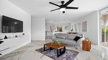 Deluxe House | Living area | 32-inch flat-screen TV with digital channels