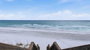 A beach view with a wooden structure in the foreground. - Seagrove Crush- Renovated- Steps to Private Beach! (Santa Rosa Beach)