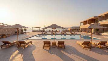 Seasonal outdoor pool, open 9:00 AM to 7:00 PM, pool umbrellas