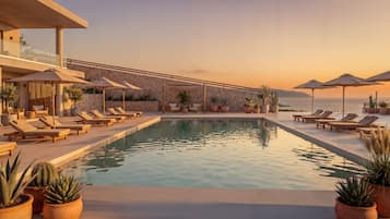 Seasonal outdoor pool, open 9:00 AM to 7:00 PM, pool umbrellas