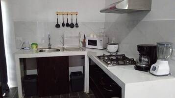 Fridge, microwave, stovetop, coffee/tea maker