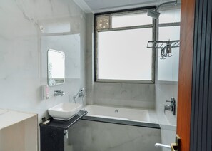 Double Bed with Bathtub | Bathroom | Hair dryer, slippers, towels, soap - KS Palace Sarnath (Sarnath)