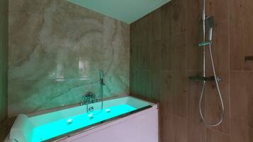 Jetted bath, hair dryer, towels, soap
