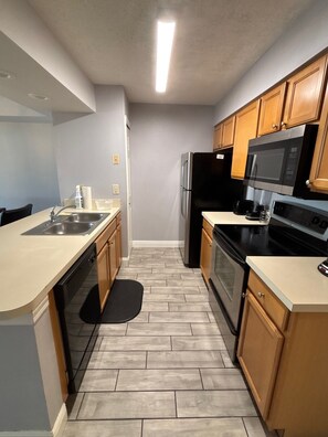 Microwave, oven, stovetop, dishwasher - Relax After the Parks – 3BR Condo w/ Pool Near Disney (Kissimmee)