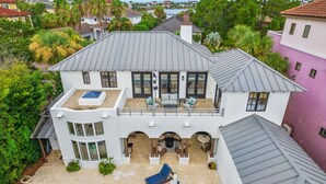 A two-story house with a pool, outdoor seating, and a covered patio. - ☀️Private pool | Luxury | Golf Cart | 6 Bikes | Villa Tranquility☀️ (Destin)