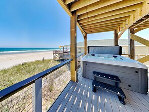 A wooden deck with a hot tub, overlooking a beach. - Shore Is Something (Sneads Ferry)