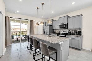 Fridge, microwave, oven, stovetop - Luxury 5BR Home w/ Pool at Windsor Island (Davenport)
