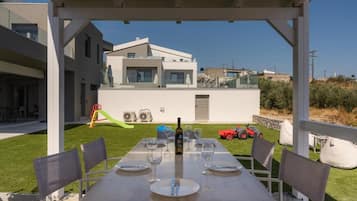 Deluxe Villa, Balcony, Pool View | Outdoor dining