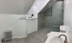 Shower, hair dryer, towels, toilet paper