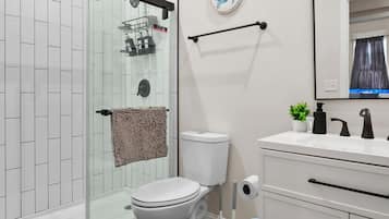 Shower, hair dryer, towels, soap