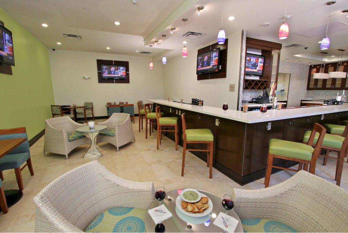 Gather for cocktails and conversation in the stylish lounge bar.