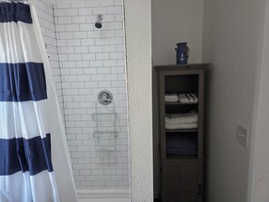 Shower, hair dryer, towels, toilet paper