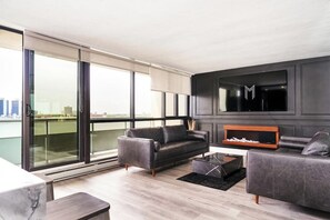 TV, fireplace - 902 - Stylish Waterfront Executive Condo (Windsor)