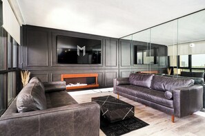 TV, fireplace - 902 - Stylish Waterfront Executive Condo (Windsor)
