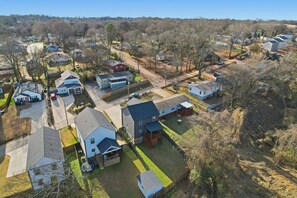 A residential area with multiple houses, roads, and a clear sky. - 4 Bedroom House Perfect for Large Groups Sleeps 10 (Greenville)