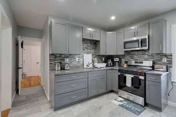 Fridge, microwave, stovetop, coffee/tea maker