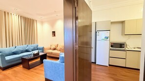 Suite familiare | Area soggiorno | Caminetto