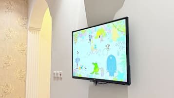 Deluxe Apartment, 1 King Bed | Living area | Fireplace