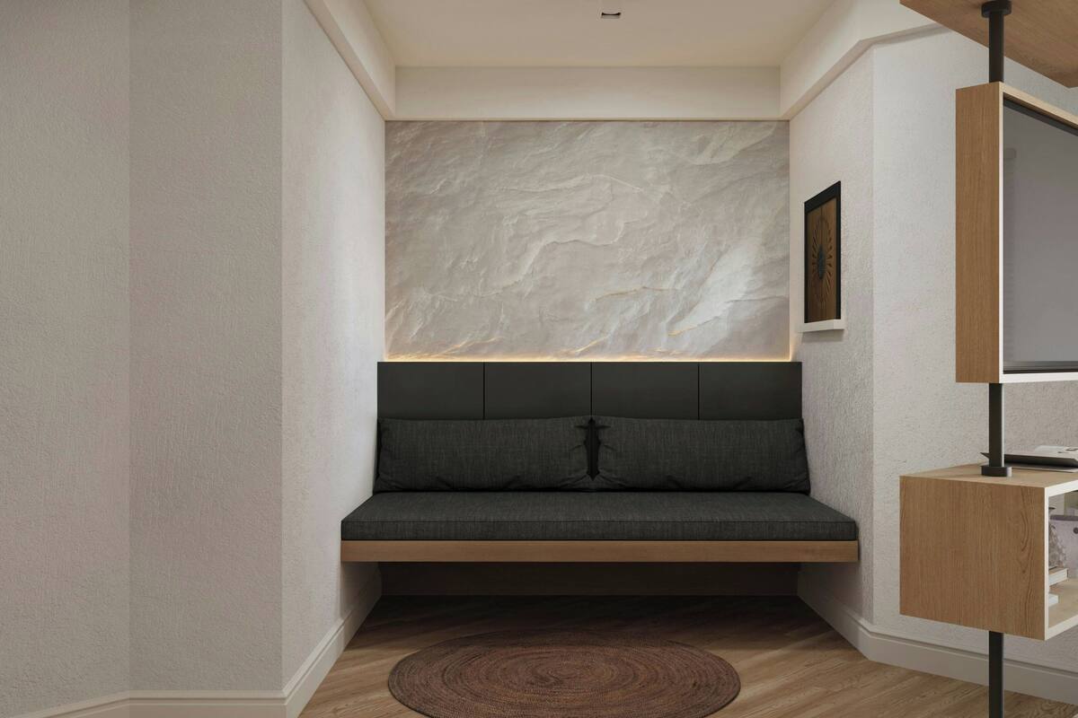 A corner seating area with a built-in bench, a textured wall, and a small wooden side table.