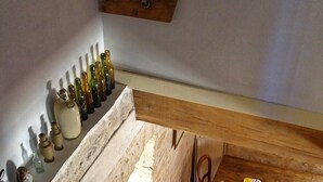 A rustic staircase with wooden railings and a stone wall. - The Parrot House (Floirac)