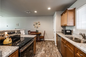 Fridge, microwave, oven, stovetop - Modern Retreat | RV-Friendly | Prime Location by Park (Kingman)